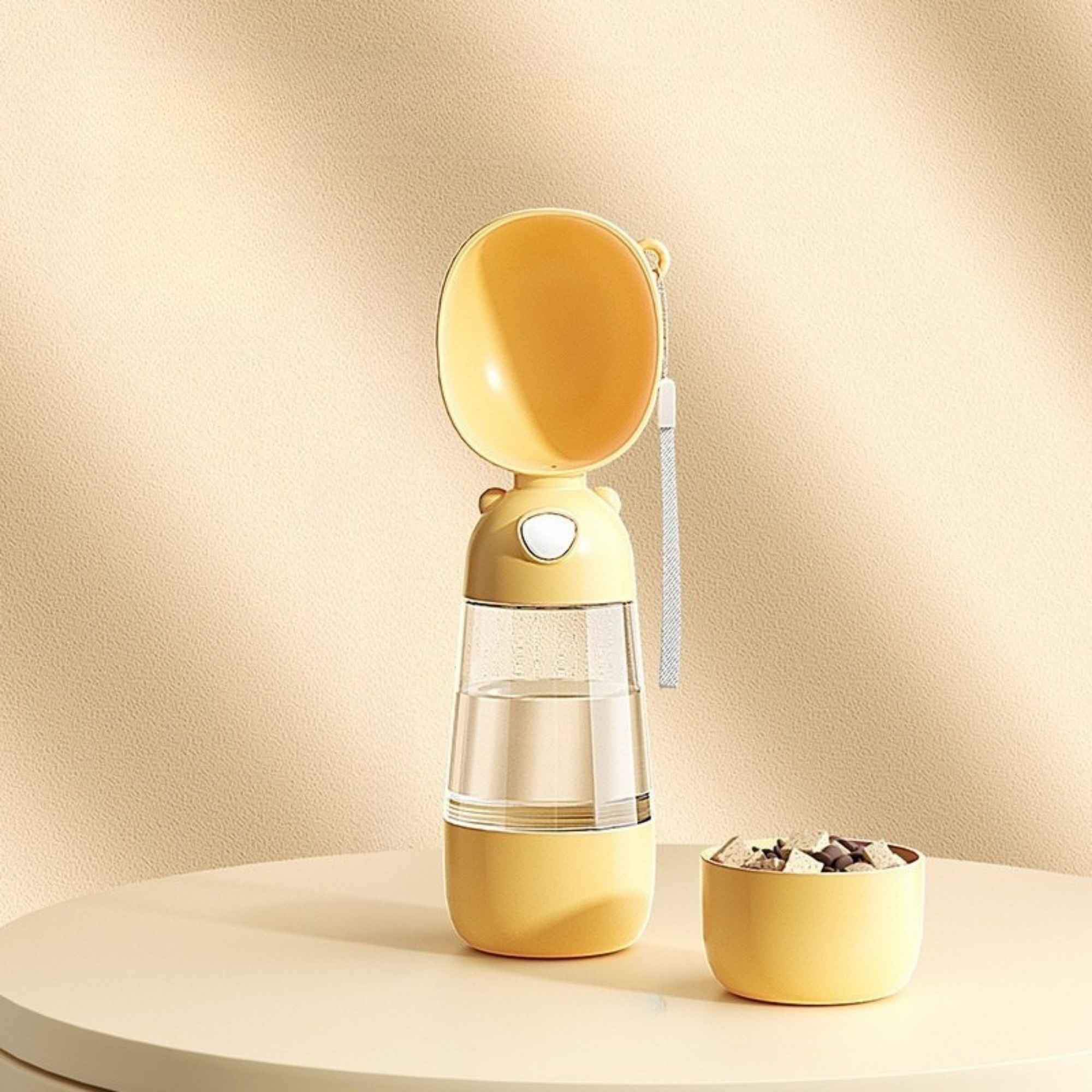 Yellow 2-in-1 portable dog and cat water bottle with removable food container.