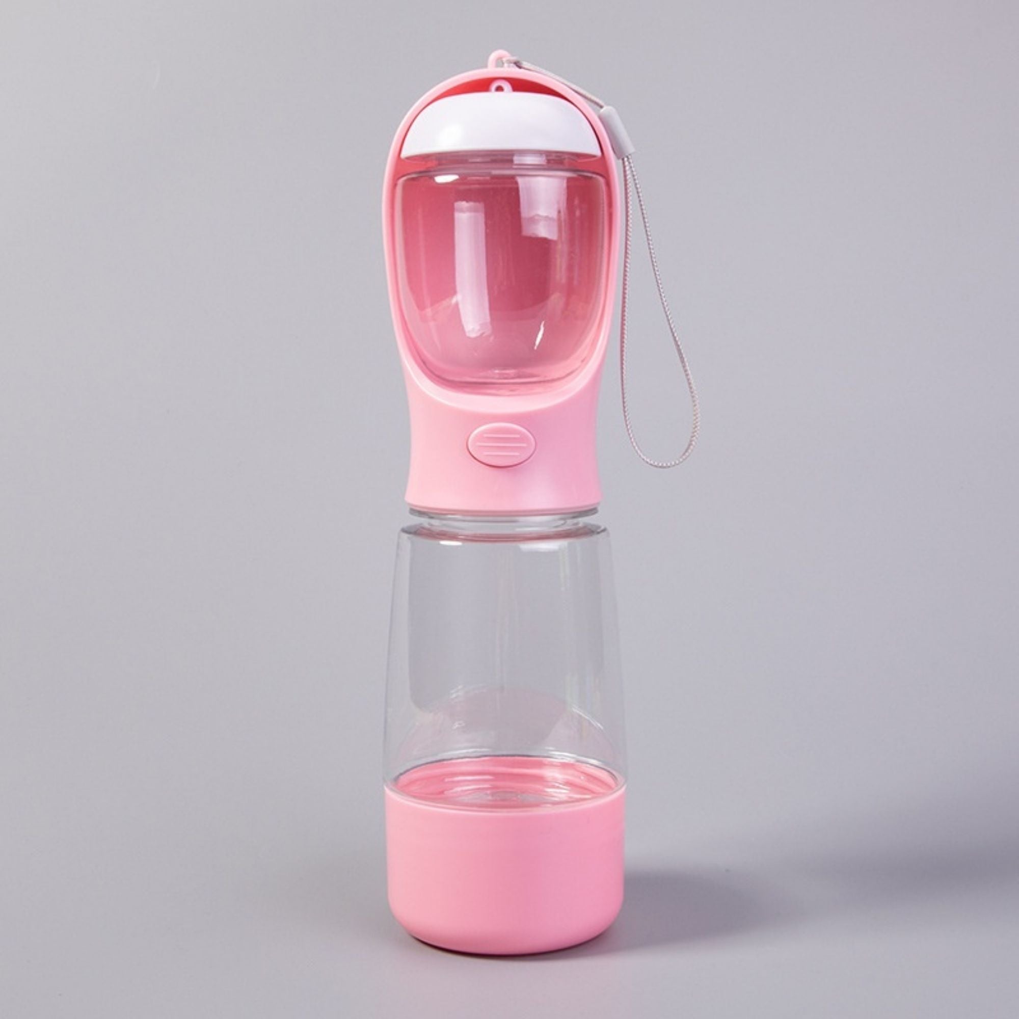 Pink 3-in-1 portable pet travel bottle with food storage, water bottle, and waste bag dispenser.