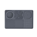 Gray rectangular silicone lick mat feeding tray for dogs and cats with an integrated food bowl and multiple textured licking surfaces.