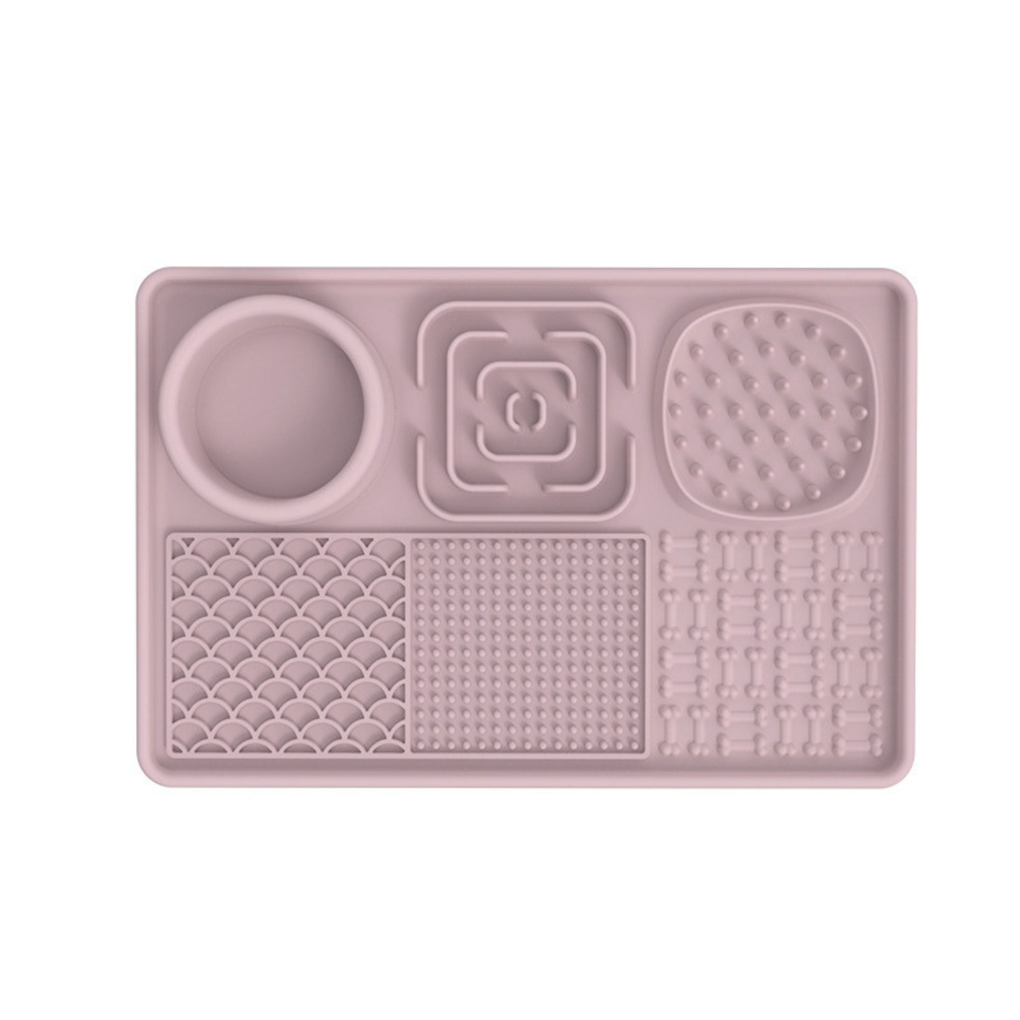 Pink rectangular silicone lick mat feeding tray for dogs and cats with an integrated food bowl and multiple textured licking surfaces.