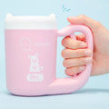 Dog and cat paw cleaner with ergonomic handle.