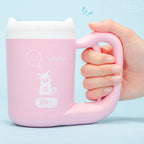 Dog and cat paw cleaner with ergonomic handle.