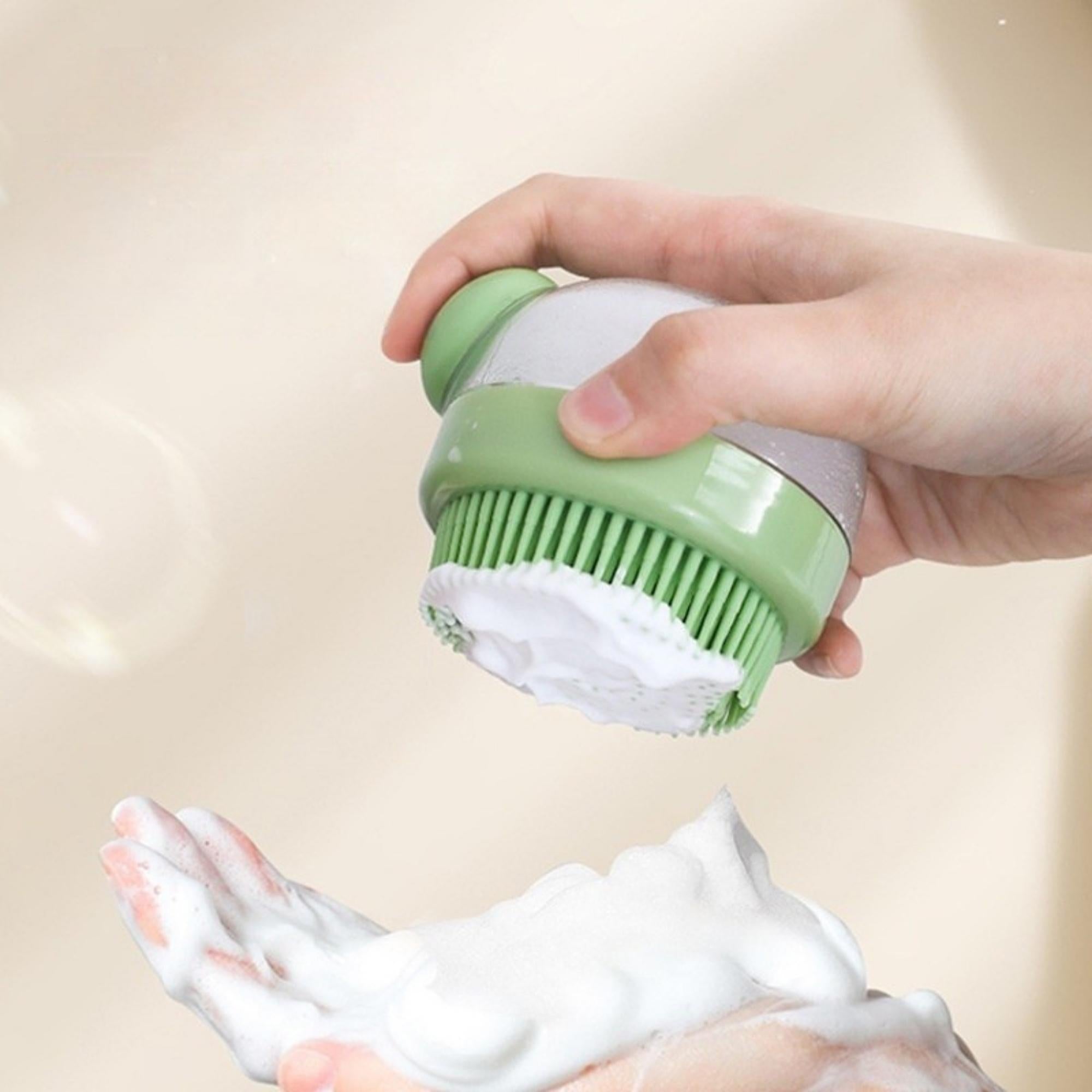 Green silicone bath brush dispensing rich foam for bathing cats and dogs.