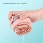 Pink silicone bath brush with a built-in shampoo dispenser releasing shampoo with one press for cats and dogs.
