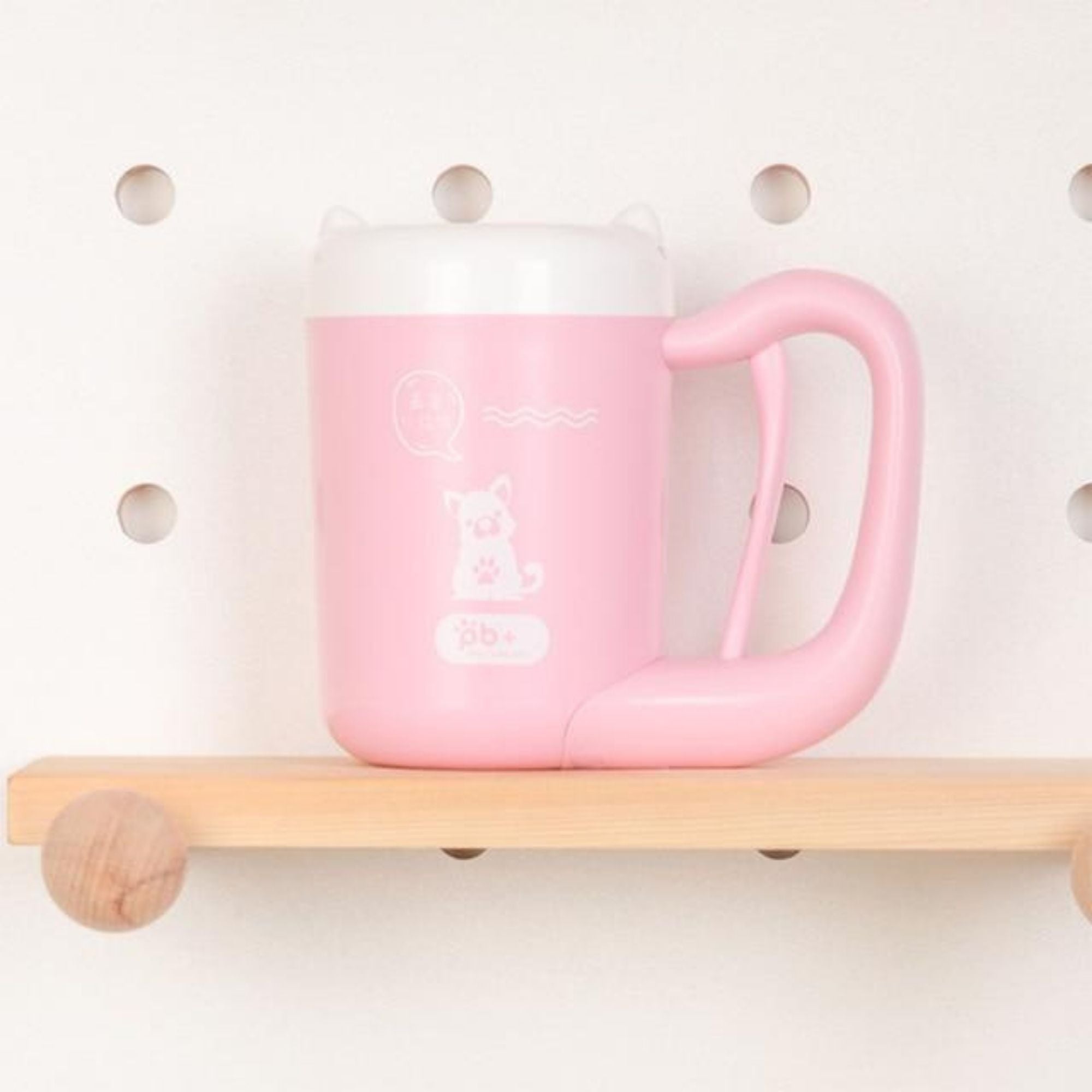 Pink portable dog and cat paw cleaner.