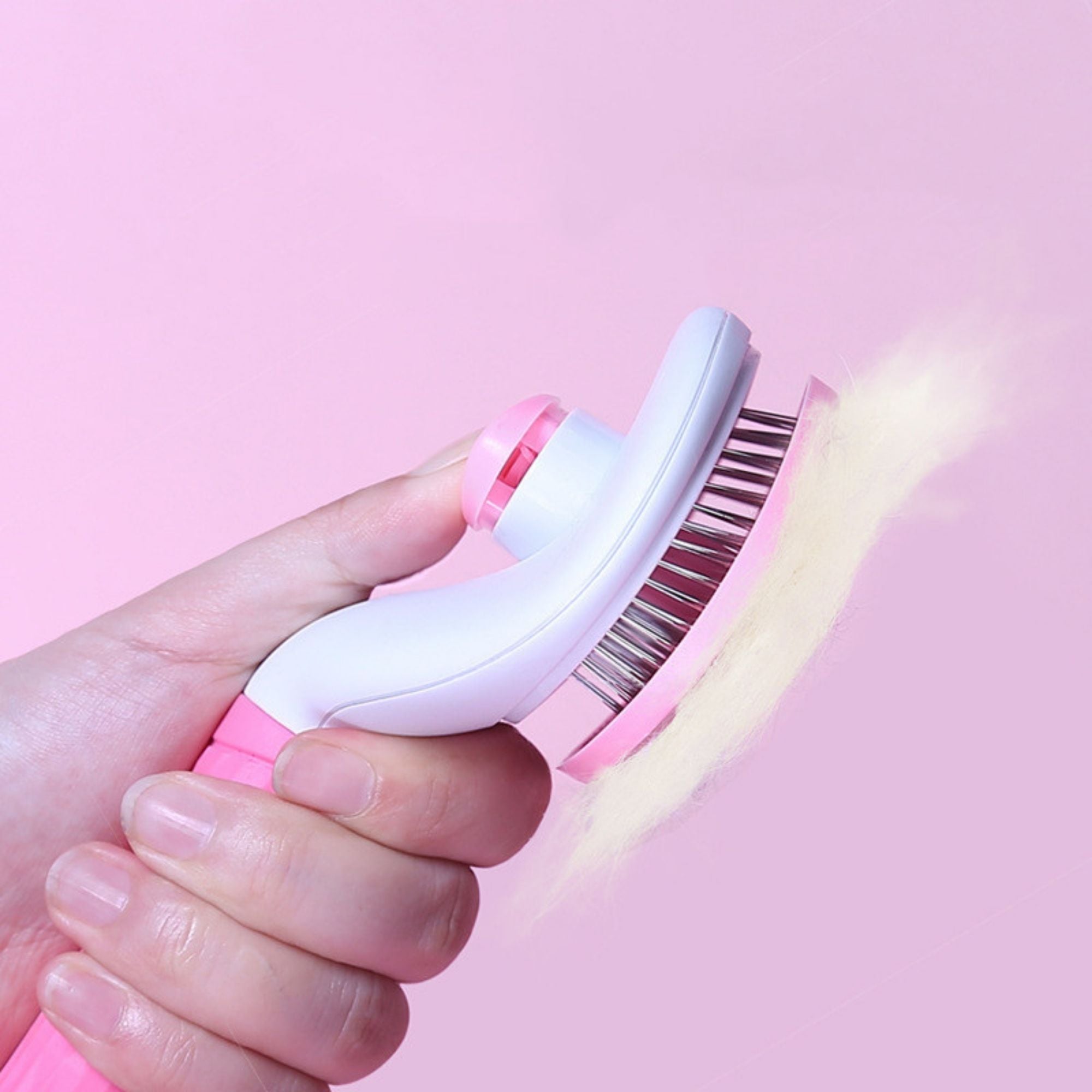 Self-cleaning pet slicker brush with one-button hair release.