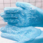 Close-up of a blue silicone pet grooming glove with soft massage bristles.